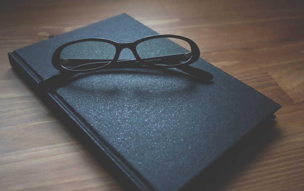 glasses, notebook, wooden